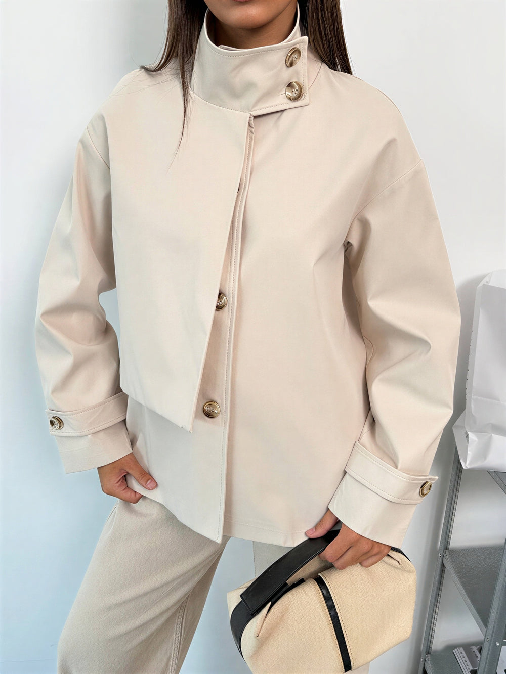 Short transitional jacket with a stand-up collar – Beige